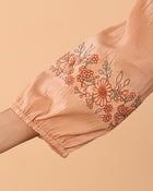 Women Peach Floral Embroidered Cotton Peplum Top